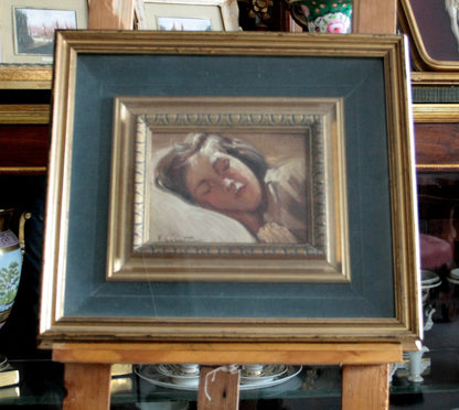 Immagine di un quadro incorniciato di una bambina dormiente di Francesco Galante, opera firmata
