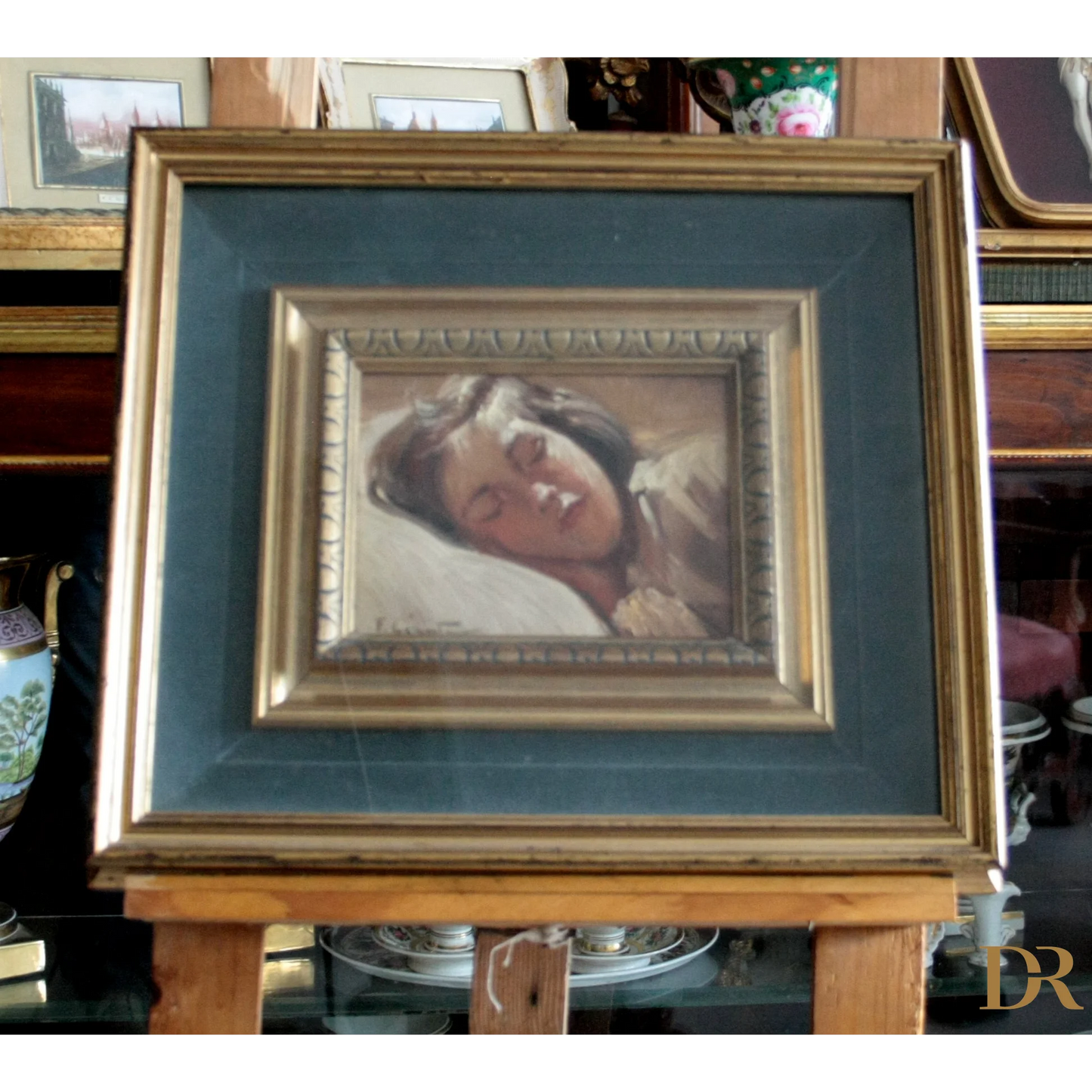 Immagine di un quadro incorniciato di una bambina dormiente di Francesco Galante, opera firmata