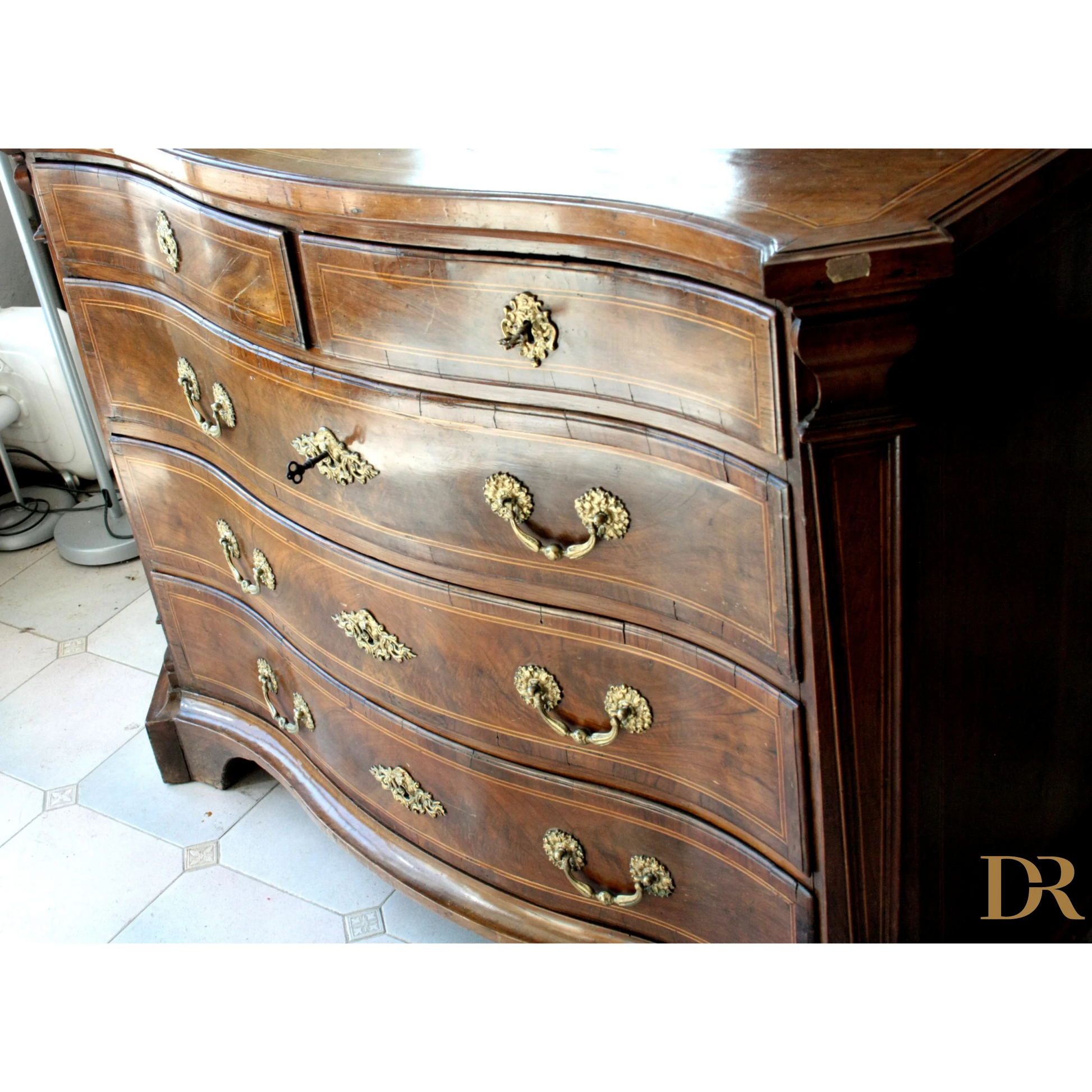 Antique bombe chest of drawers with ornate brass hardware for vintage casa design