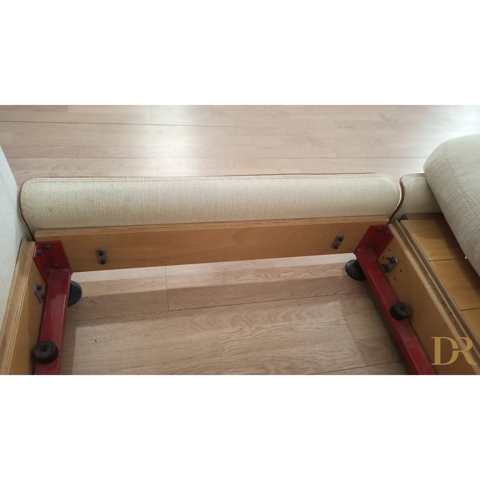 White cylindrical foam roller with red mounting brackets part of riccardo arbizzoni modello redifiori set divano zanotta 1978
